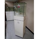 A jeweller's glass display cabinet on stand.