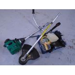 A Qualcast petrol strimmer with accessories.