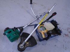 A Qualcast petrol strimmer with accessories.