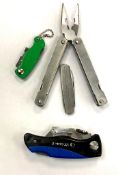 A folding pocket multi tool together with three folding pocket knives