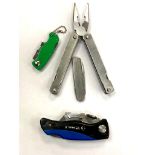 A folding pocket multi tool together with three folding pocket knives