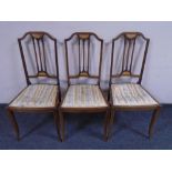 A set of three 19th century inlaid mahogany bedroom chairs.