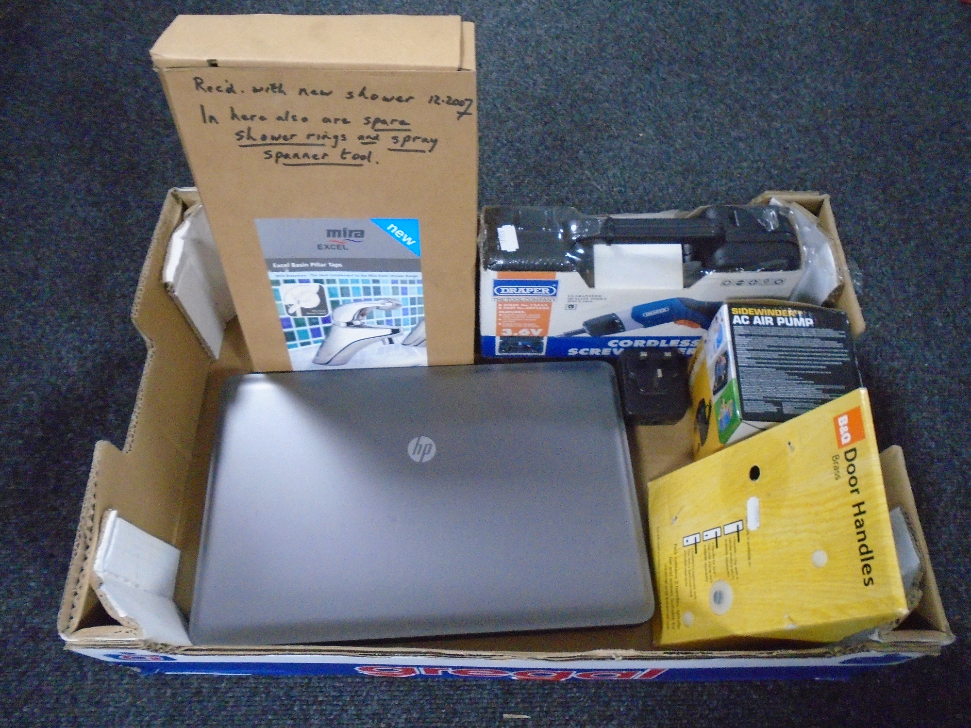 A box containing HP laptop, Garmin sat nav, Draper cordless screwdriver kit (new),