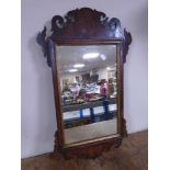 A Victorian Chippendale style wall mirror.