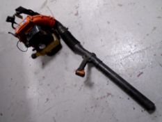 A Husqvarna 140b petrol garden leaf blower.