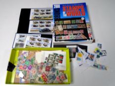 A Stanley Gibbons stamps of the world book together with a small quantity of loose world stamps