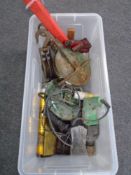 A crate containing electric drill, metal pulleys, bottle jack etc.