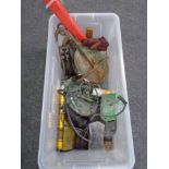 A crate containing electric drill, metal pulleys, bottle jack etc.