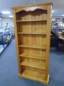A set of pine open bookshelves,