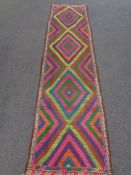 A Suzni kilim runner 293cm by 76cm