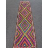 A Suzni kilim runner 293cm by 76cm