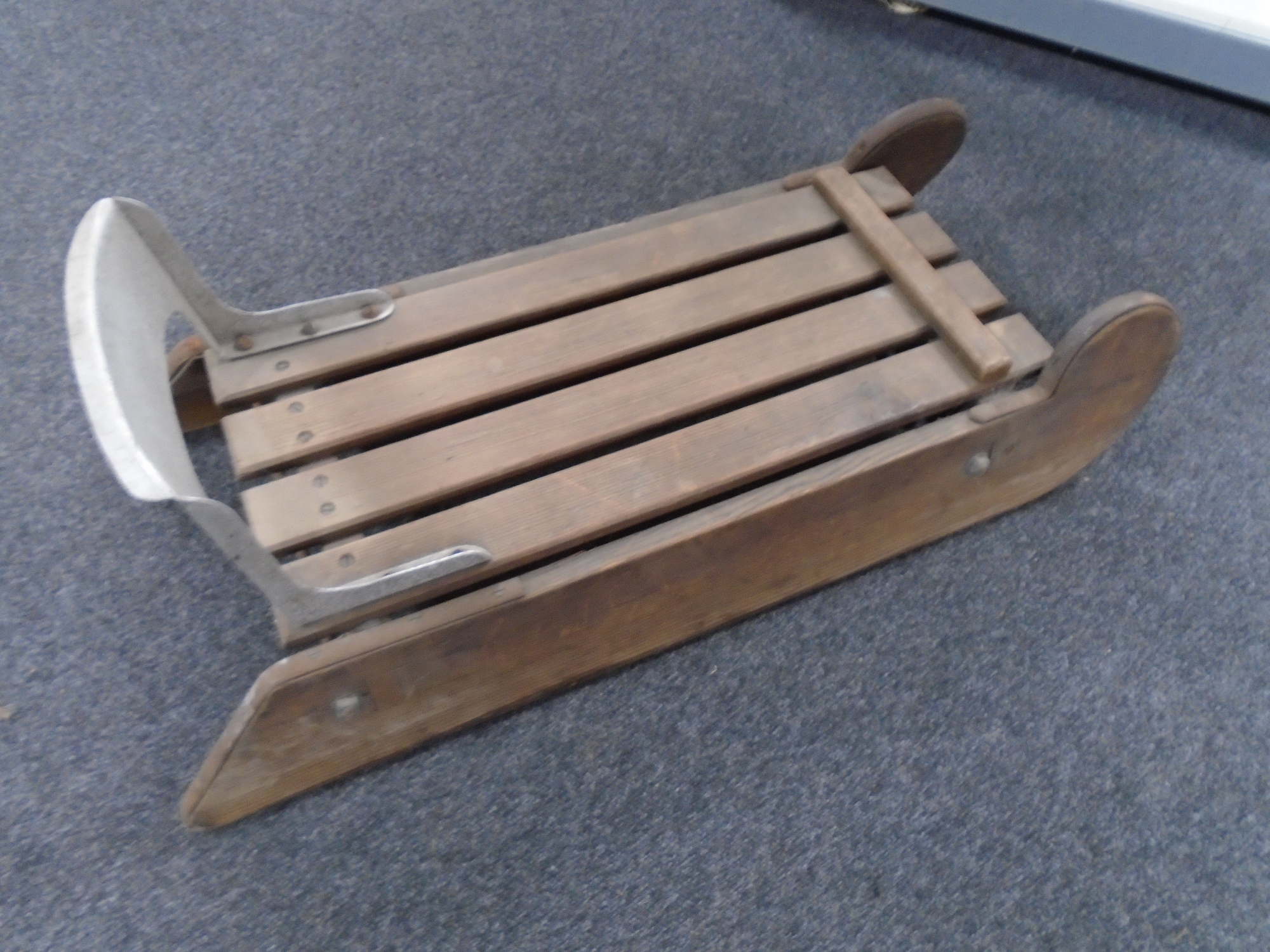 A wood and metal sledge.