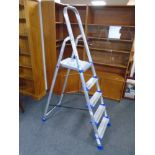 A Werner aluminium folding five tread stepladder.