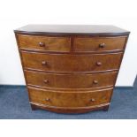 A Victorian style two-over-three bow fronted five drawer chest.