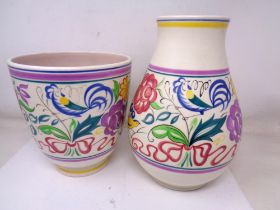 Two Poole pottery vases (tallest 25cm).