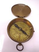 A brass pocket compass.