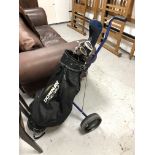 A folding golf trolley, a Donnay golf bag,
