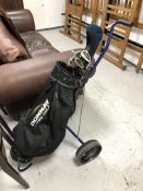 A folding golf trolley, a Donnay golf bag,