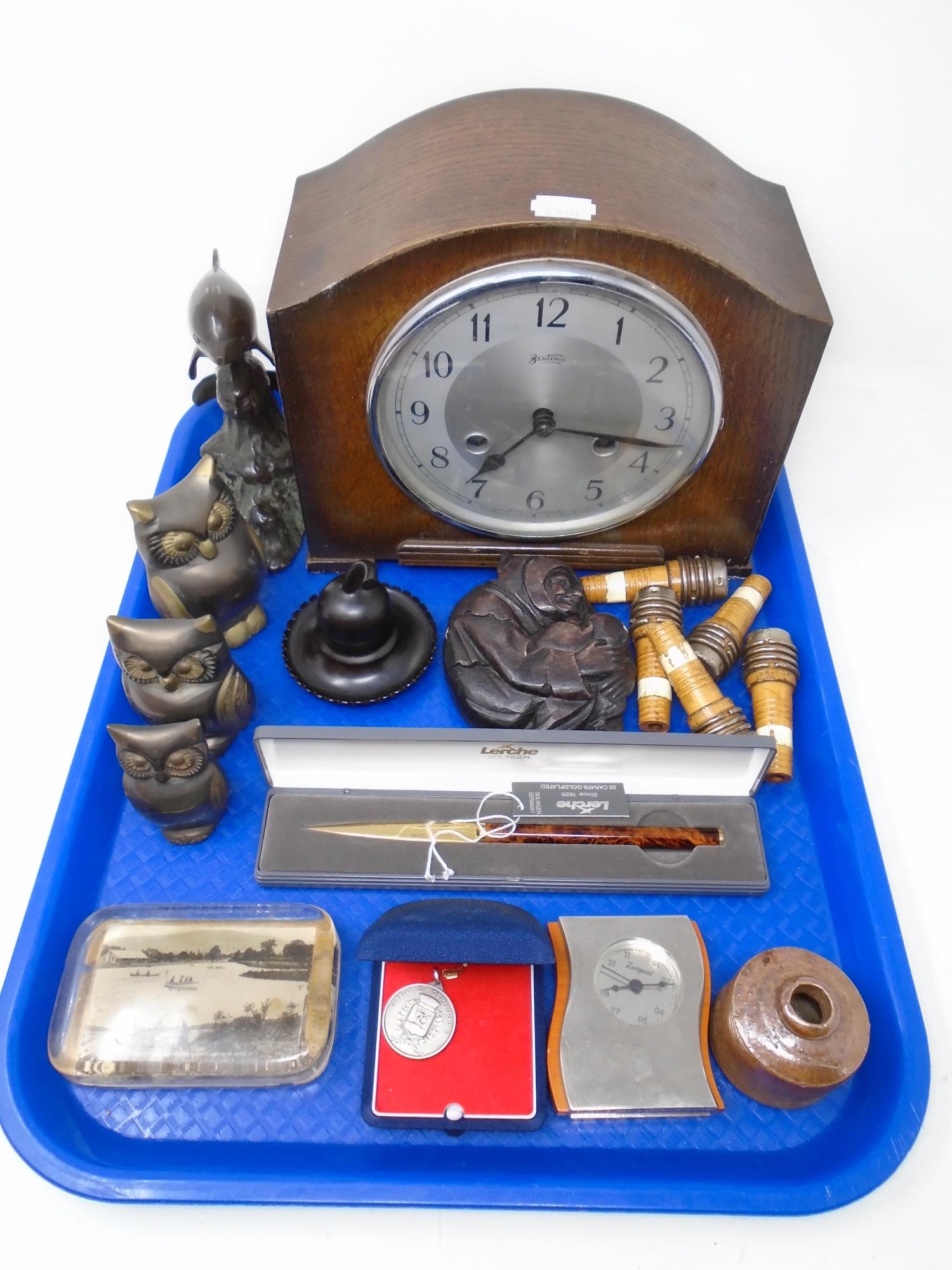 A tray containing Bentima oak cased mantel clock, boxed Lerche letter knife, glass paperweight,