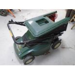 A Black & Decker Stripemaster 16.5" cut electric lawn mower with lead and grass box.