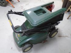 A Black & Decker Stripemaster 16.5" cut electric lawn mower with lead and grass box.