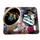 A tin containing United Nations enamelled badges, Steward medal, brass seal,
