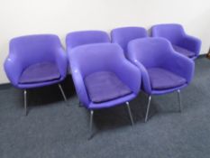 A set of six armchairs on metal legs upholstered in purple fabric designed by Robin Day for Hille