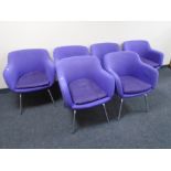 A set of six armchairs on metal legs upholstered in purple fabric designed by Robin Day for Hille