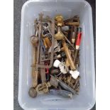 A box containing assorted hand tools, antique doorknobs etc.