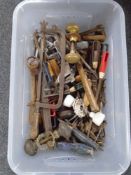 A box containing assorted hand tools, antique doorknobs etc.