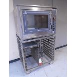 A Euro Oven Bakery 3 stainless steel oven on trolley with four aluminium trays.