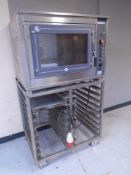 A Euro Oven Bakery 3 stainless steel oven on trolley with four aluminium trays.