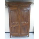 A French walnut double door armoire,