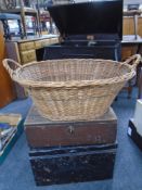 A metal deed box, a further wooden box and a wicker basket.