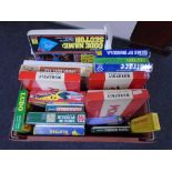 A crate containing a quantity of assorted board games including Monopoly, Rat Race, Cluedo,