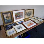 A crate containing a quantity of pictures including a limited edition prints after Richard Marshall,