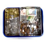 A tray containing a large quantity of assorted foreign coinage, British pennies, bank notes etc.