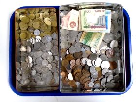 A tray containing a large quantity of assorted foreign coinage, British pennies, bank notes etc.
