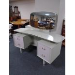 A 20th century G-Plan E Gomme designed two-tone dressing table with matching four drawer chest.