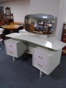 A 20th century G-Plan E Gomme designed two-tone dressing table with matching four drawer chest.