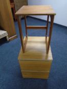 A 20th century teak occasional table together with an oak effect two drawer bedside chest.