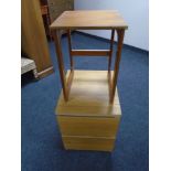 A 20th century teak occasional table together with an oak effect two drawer bedside chest.