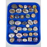 A tray containing a collection of metal and porcelain trinket boxes.