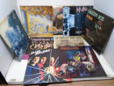 A box containing approximately 38 LPs including Moody Blues, Queen, Magnum, Bill Wyman, Marillion,