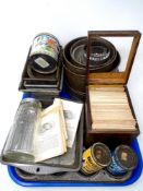 A tray containing vintage kitchenalia including cake tins, flower sifter, recipe cards in box,