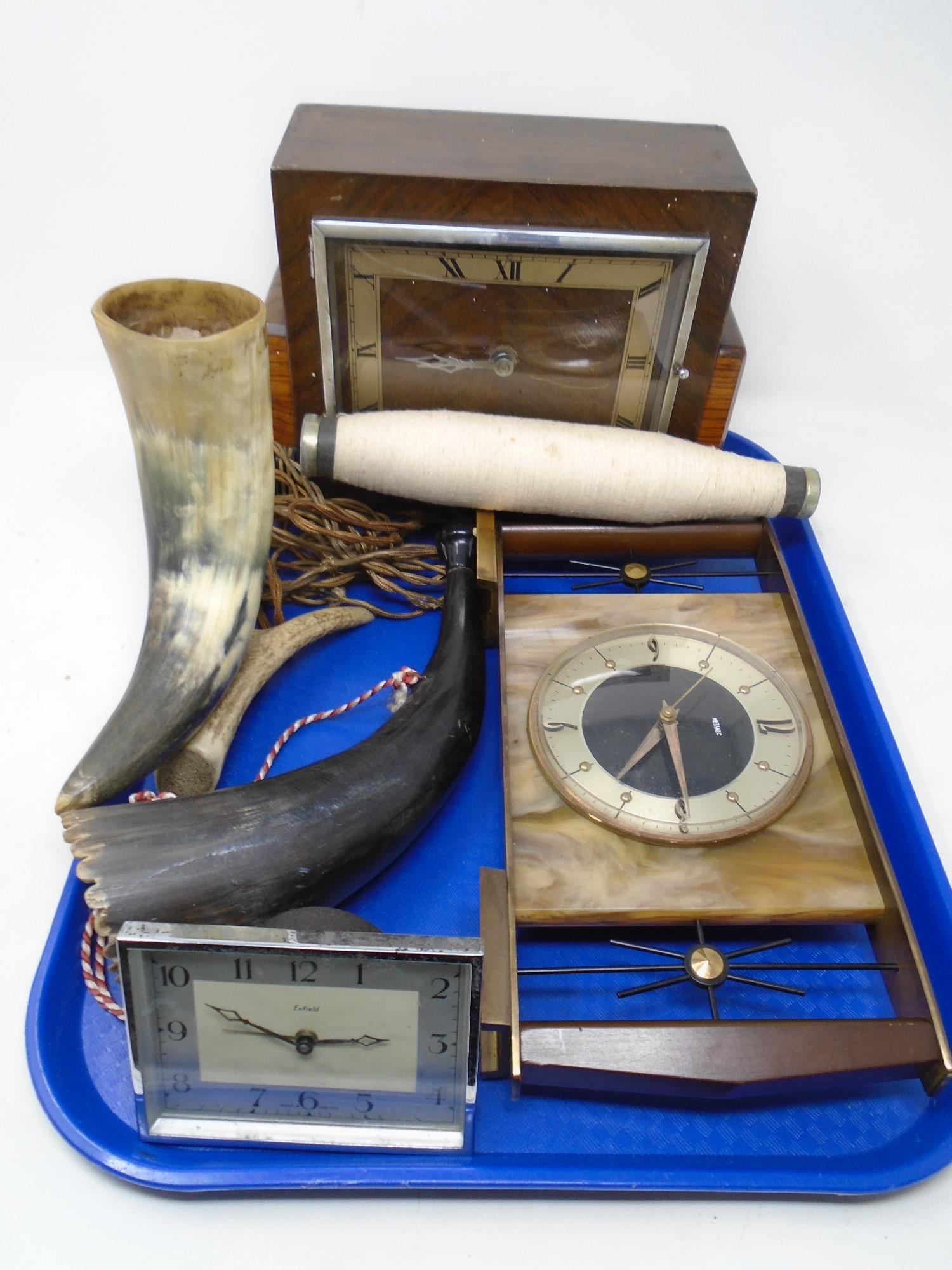 A tray containing mid-20th century mantel clocks by Enfield,