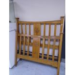 A pair of Edwardian oak Art Nouveau rail bed ends.