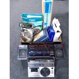 A box containing electricals including Christmas lights, a music maker, portable record player,