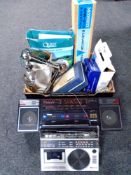 A box containing electricals including Christmas lights, a music maker, portable record player,