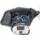 A Kewtech KT63 multifunction tester with leads in carry bag.